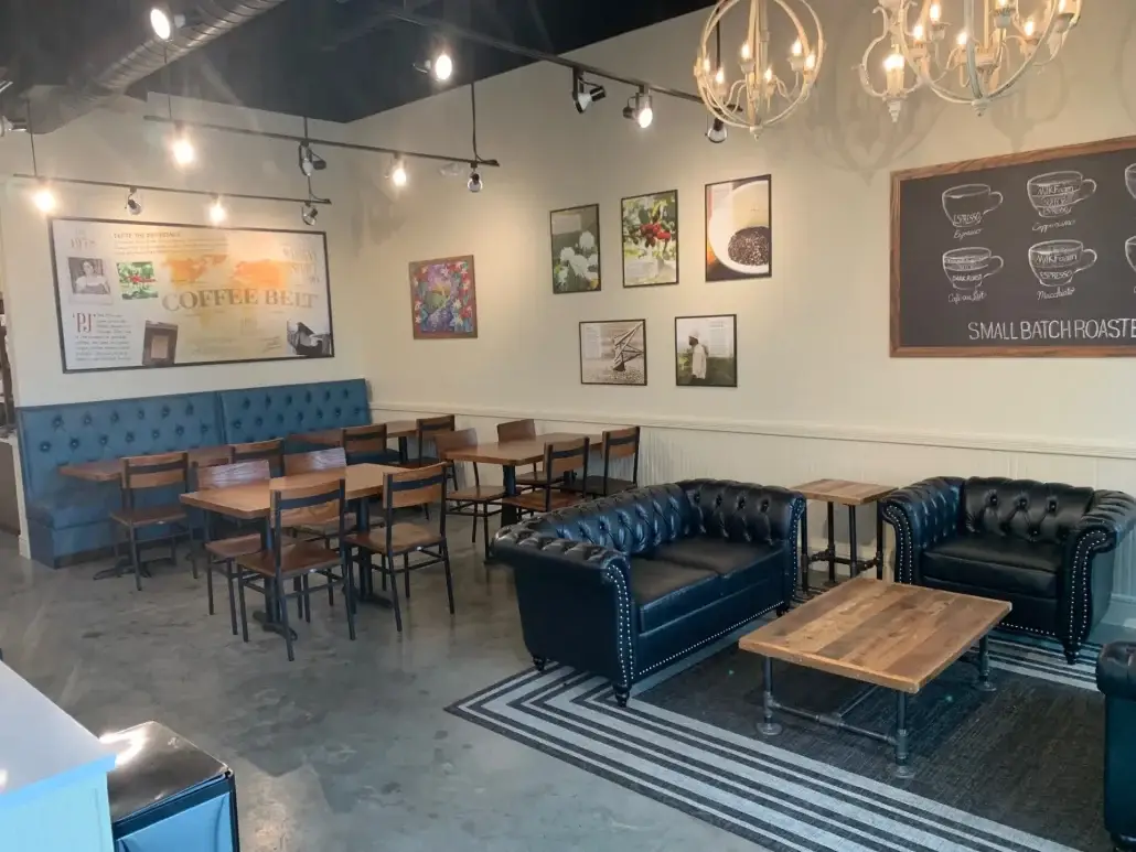 Completed coffee shop seating interior built by Urban Constructors