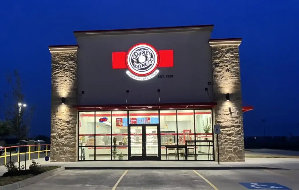 Shipley Do-Nuts storefront completed by Urban Constructors at dusk