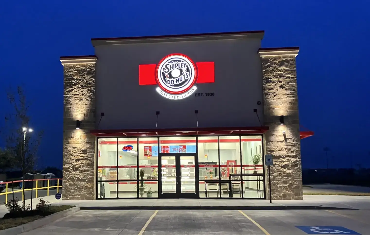 Shipley Do-Nuts storefront completed by Urban Constructors at dusk